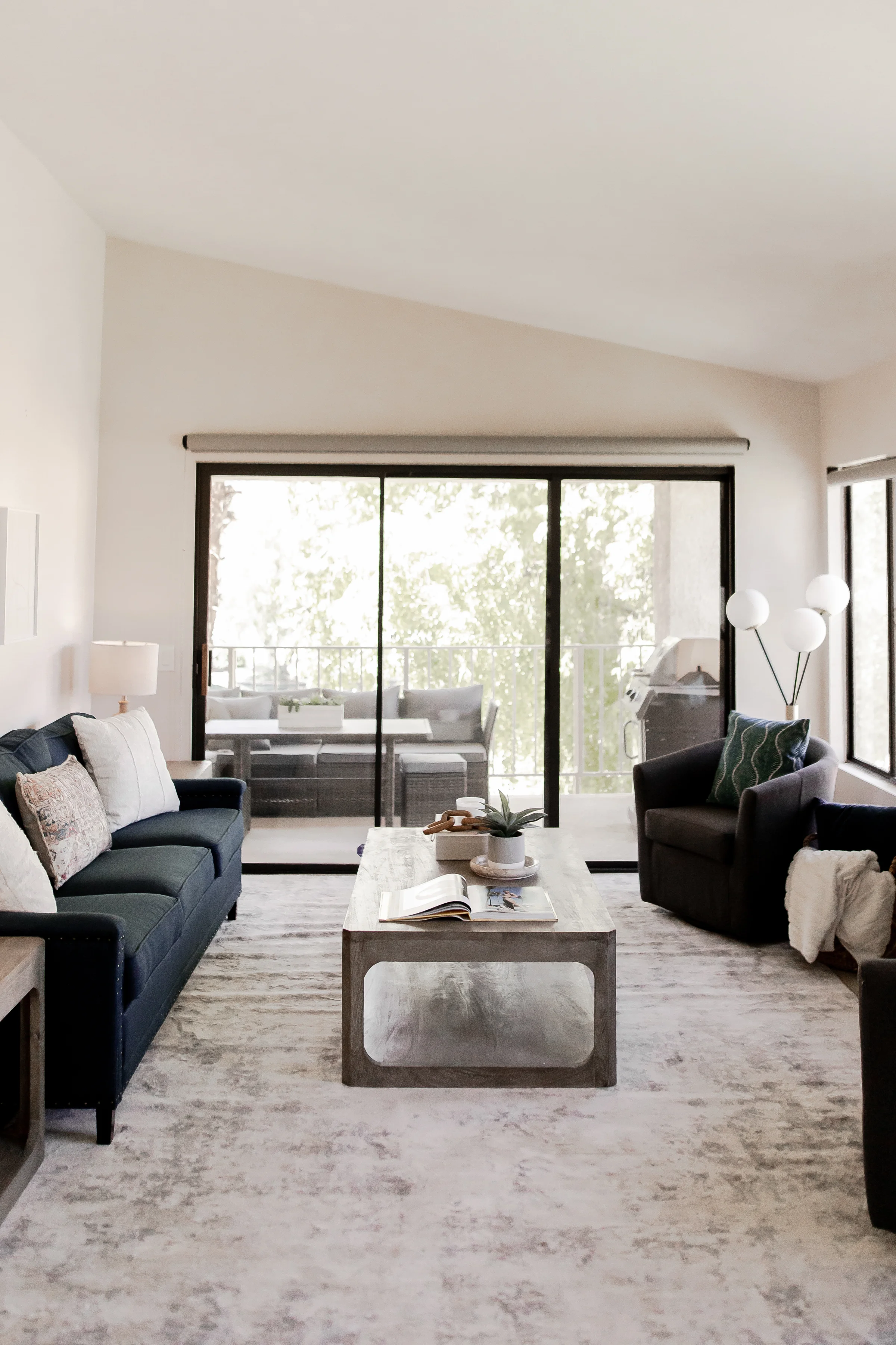Living room with balcony at The French Swan, PGA West
